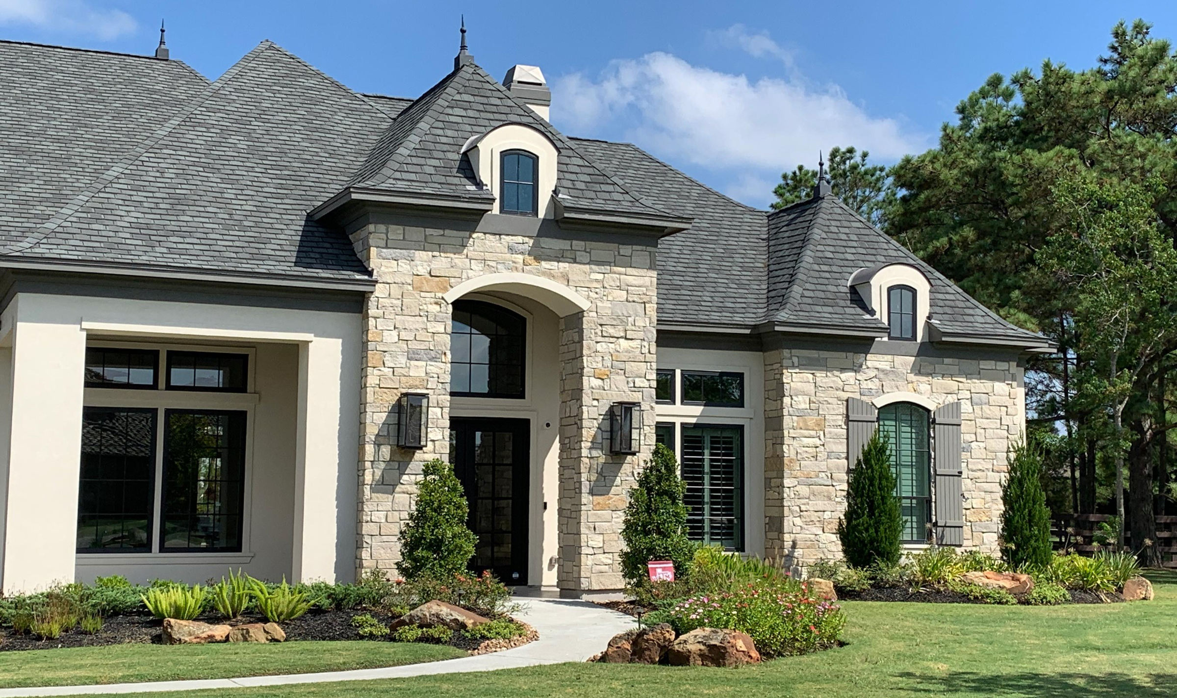 Luxury residence clad with light natural stone veneer